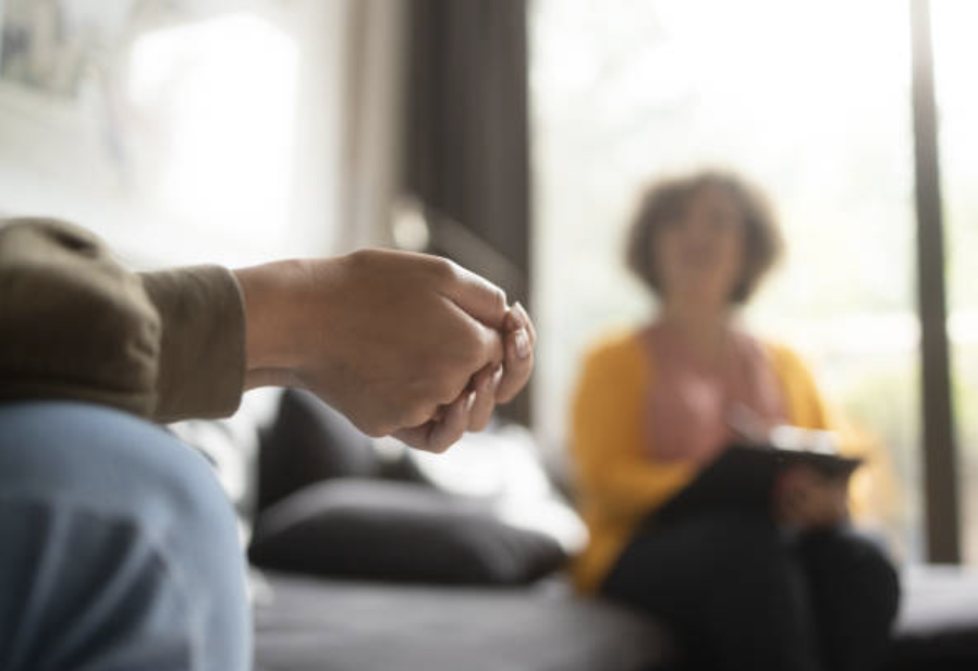 mental health carers in a meeting at an individuals home